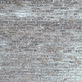 En grå murstensvæg